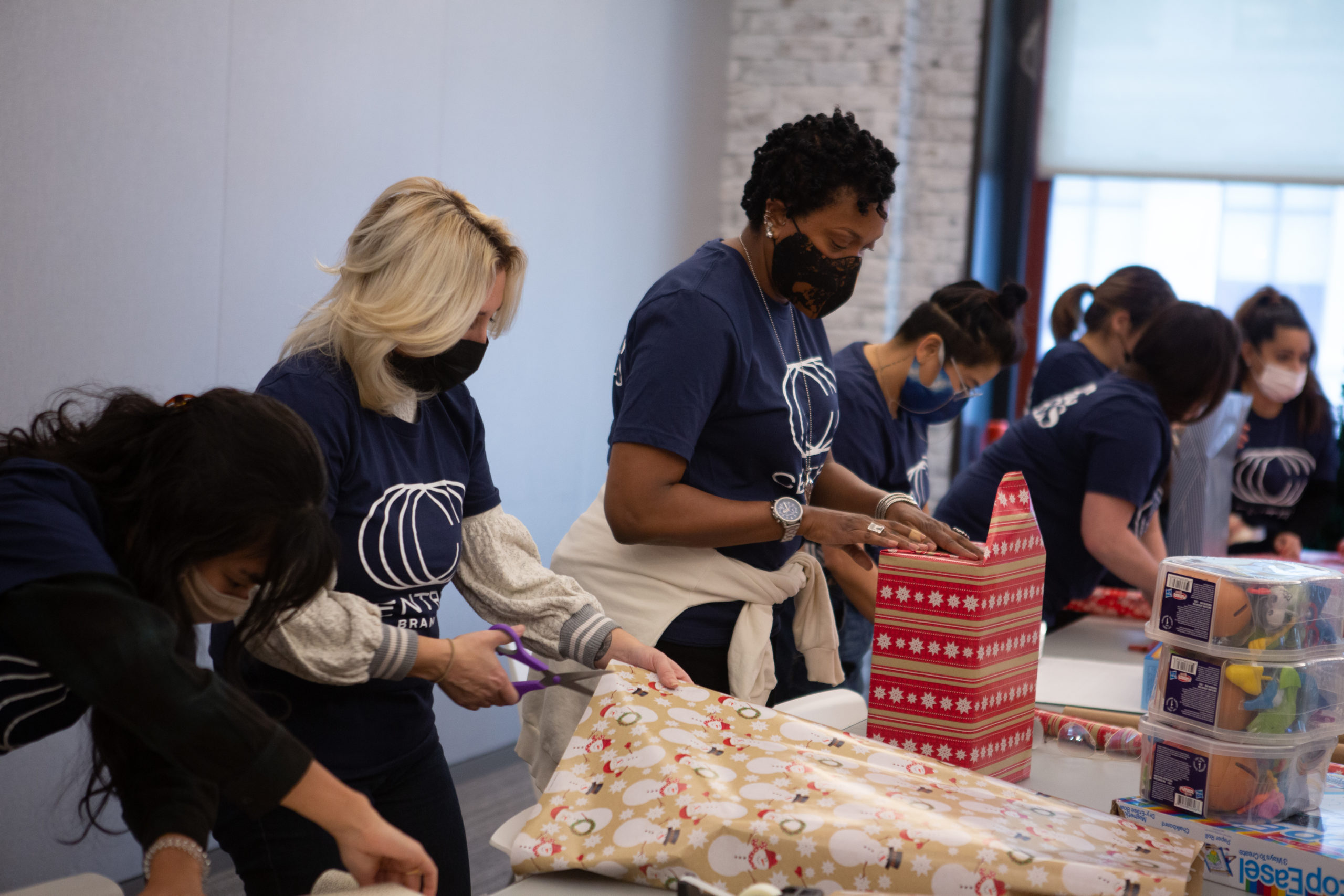 wrapping presents for WHEDco for philanthropy partnership